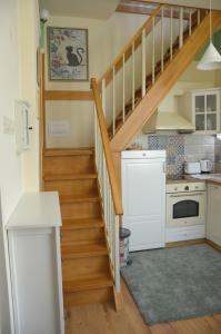 a kitchen with a staircase in a house at Our House In The Town in Veliko Tŭrnovo