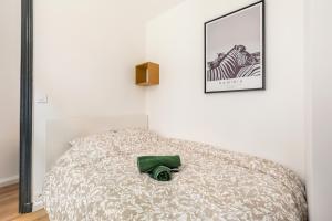 Ένα ή περισσότερα κρεβάτια σε δωμάτιο στο Cosy appartement proche gares #2