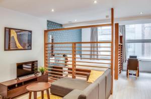 a living room with a couch and a table at Terlon Apartments in Liverpool