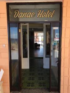 a dane hotel entrance with the door open at Hotel Danae in Piriápolis