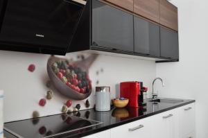 a kitchen with a bowl of fruit on the counter at Apartman Benjo in Hermagor