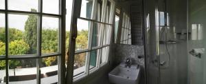 a bathroom with a sink and a window at Junior Suites Venezia in Venice