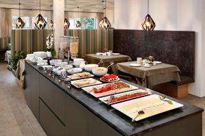 a buffet line with many plates of food on it at Pension Pichler in Tirolo