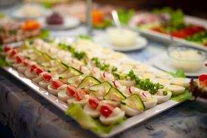 a bunch of appetizers on a buffet table at Pomorze Ustka in Ustka