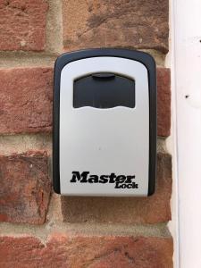 a toaster is attached to a brick wall at 2 Crown Barton in Glastonbury