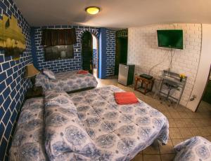 Ένα ή περισσότερα κρεβάτια σε δωμάτιο στο Hotel El Mirador KITE-SURF, WIND-SURF AND SURF