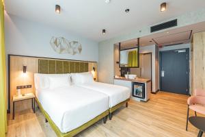 Postel nebo postele na pokoji v ubytování Barceló Budapest
