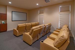 a conference room with chairs and a flat screen tv at Sun Outdoors Petoskey Bay Harbor in Petoskey +23 photos