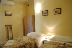 Posteľ alebo postele v izbe v ubytovaní Dreaming Piazza Bra Rooms