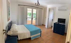 Säng eller sängar i ett rum på Villa Mare Residence