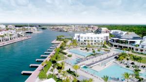 an aerial view of a resort next to the water at TRS Cap Cana Waterfront & Marina Hotel - Adults Only - All Inclusive in Punta Cana