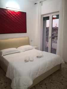 Letto o letti in una camera di Dimore Pietrapenta Apartments, Suites & Rooms - Via Lucana 223, Via Piave 23, Via Chiancalata 16