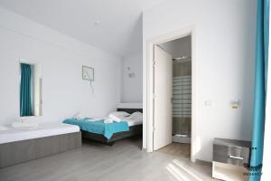 Postel nebo postele na pokoji v ubytování Regency Villa