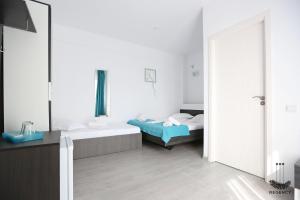 Postel nebo postele na pokoji v ubytování Regency Villa