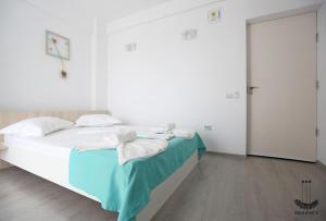 Postel nebo postele na pokoji v ubytování Regency Villa