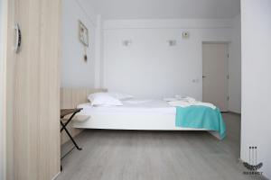 Postel nebo postele na pokoji v ubytování Regency Villa