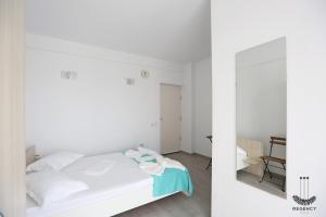 Postel nebo postele na pokoji v ubytování Regency Villa