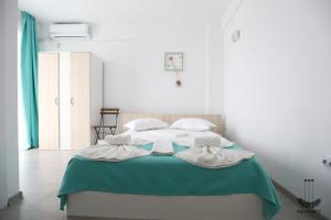 Postel nebo postele na pokoji v ubytování Regency Villa