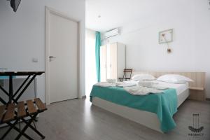 Postel nebo postele na pokoji v ubytování Regency Villa