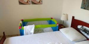 Posteľ alebo postele v izbe v ubytovaní Natalia's Apartments
