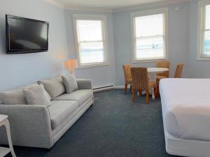 a living room with a couch and a table at Island House Hotel in Mackinac Island