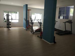 a gym with several treadmills and exercise bikes at AP Clube Lazer Total in Bertioga