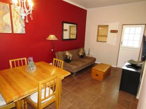 a living room with a table and a couch at Gansbaai Central Accommodation Sleeps 2 adults and 2 kids under 10 years in Gansbaai