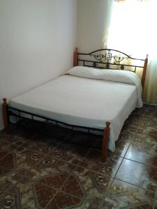 a bed in a corner of a room at Breathtaking Volcan Mountain/River Views in Volcán