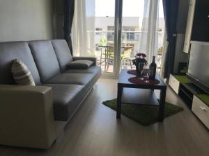 a living room with a couch and a table at Apartament Lucky in Pruszcz Gdański