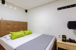 Postel nebo postele na pokoji v ubytování Hotel Colombia Avenida