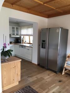 Kuchyň nebo kuchyňský kout v ubytování Apartment Hahnenkammblick