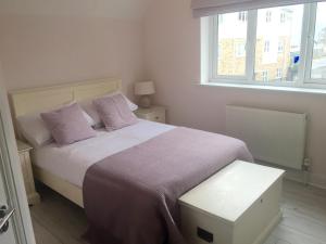 En eller flere senge i et værelse på Viking Bay House