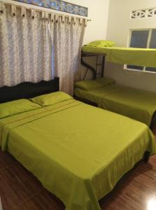 Cama ou camas em um quarto em Centro Vacacional Los Pijaos