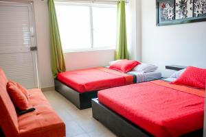 Voodi või voodid majutusasutuse Caribbean Island Hotel toas