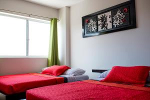 Voodi või voodid majutusasutuse Caribbean Island Hotel toas