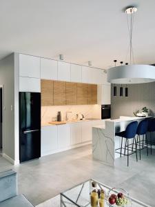 Kuchyň nebo kuchyňský kout v ubytování ZLOTA Luxury Apartments