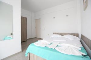 Postel nebo postele na pokoji v ubytování Regency Villa