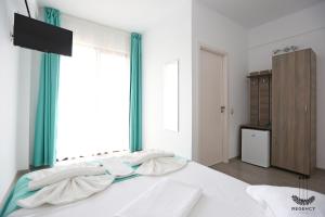 Postel nebo postele na pokoji v ubytování Regency Villa