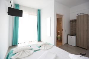 Postel nebo postele na pokoji v ubytování Regency Villa