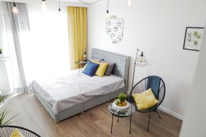 Llit o llits en una habitació de Vizzit Us Premium Apartments