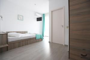 Postel nebo postele na pokoji v ubytování Regency Villa