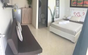 Voodi või voodid majutusasutuse Caribbean Island Hotel toas
