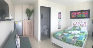 Voodi või voodid majutusasutuse Caribbean Island Hotel toas