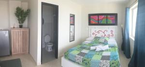 Voodi või voodid majutusasutuse Caribbean Island Hotel toas