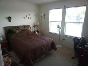 a bedroom with a bed and a window and a fan at Room in Campbell with Own Bthrm in Campbell