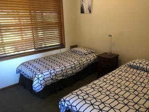 
A bed or beds in a room at 121 Montague Avenue, Kianga
