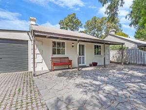 a house with a garage and a driveway at Rossanna in Port Fairy