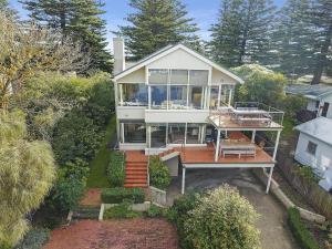 an aerial view of a large house with a deck at Shearwater Penthouse in Port Fairy