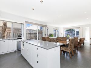 a kitchen and dining room with a table and chairs at The Townhouse in Port Fairy