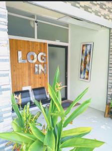 a store front with a plant in front of it at login homestay in Madiun